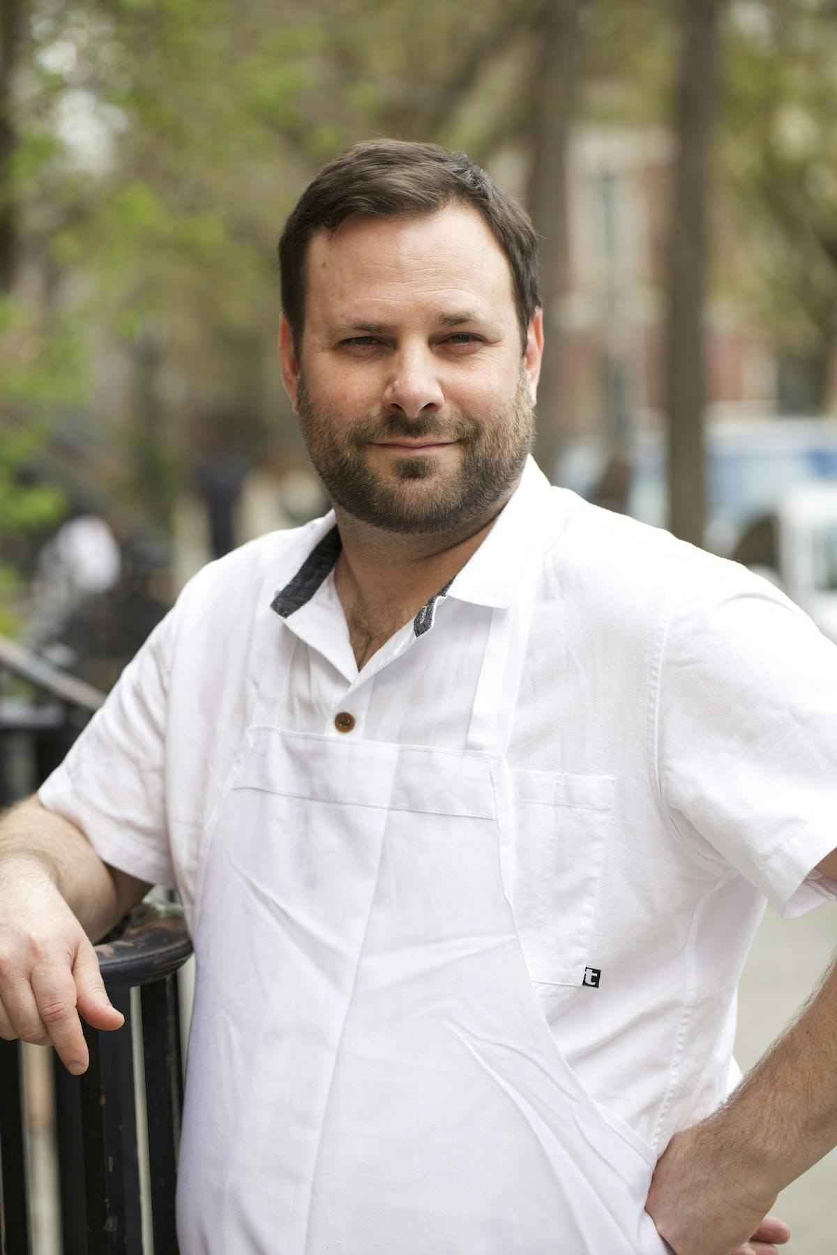 a man standing on a grill