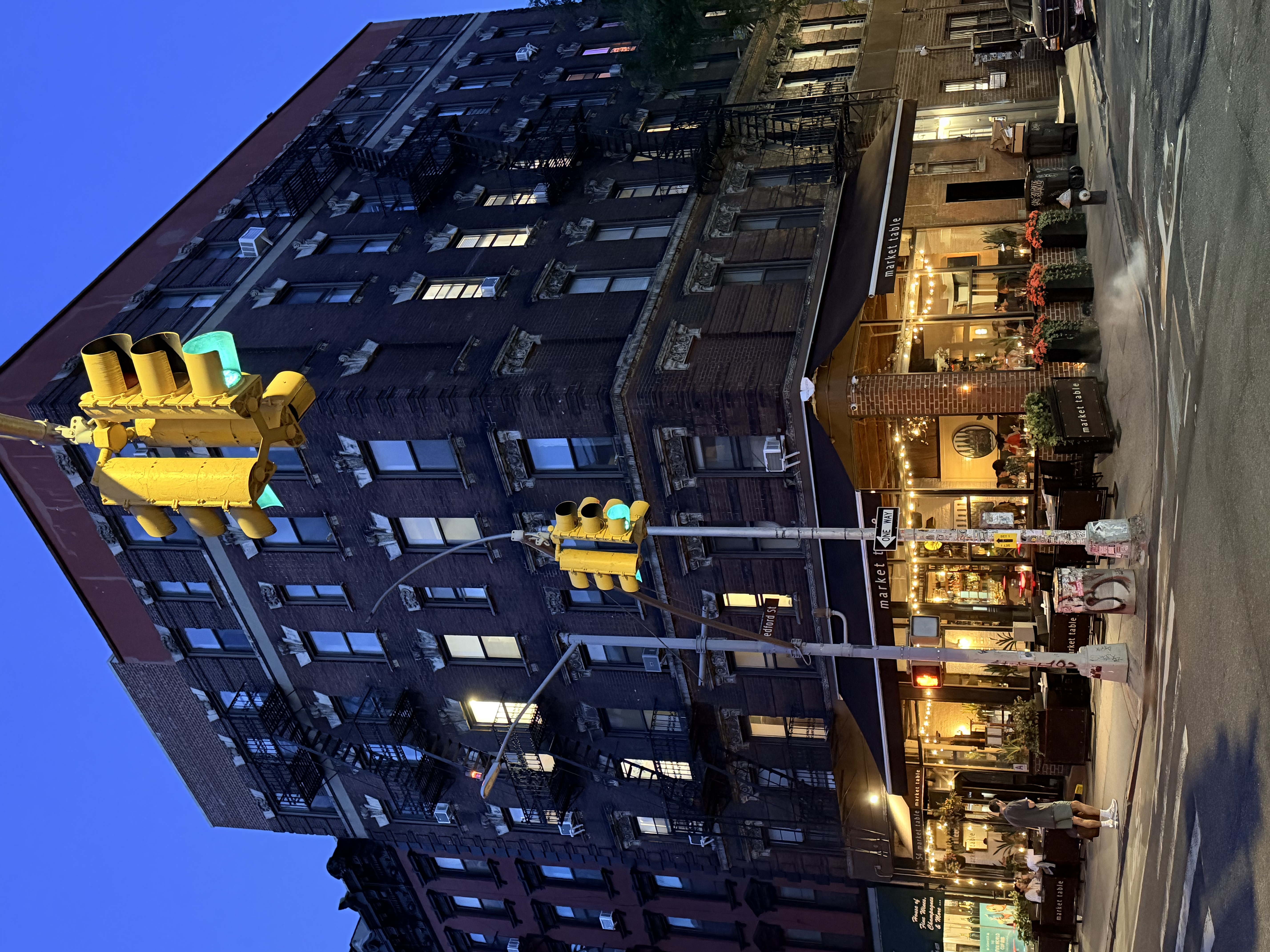 a group of people standing in front of a building