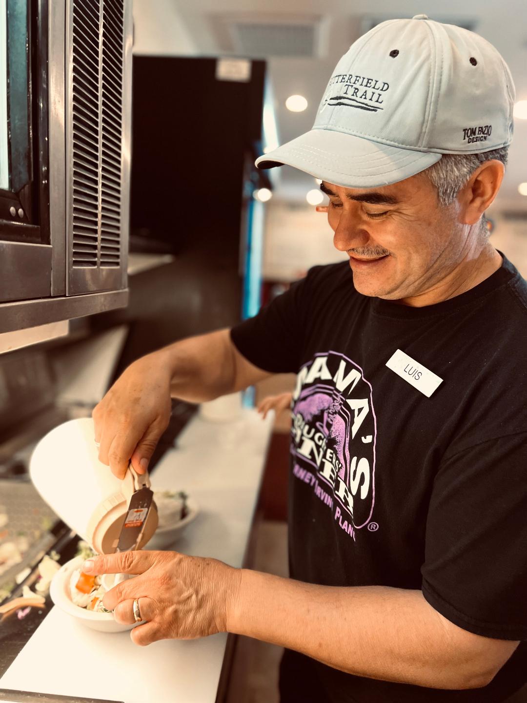 a man preparing food in a kitchen