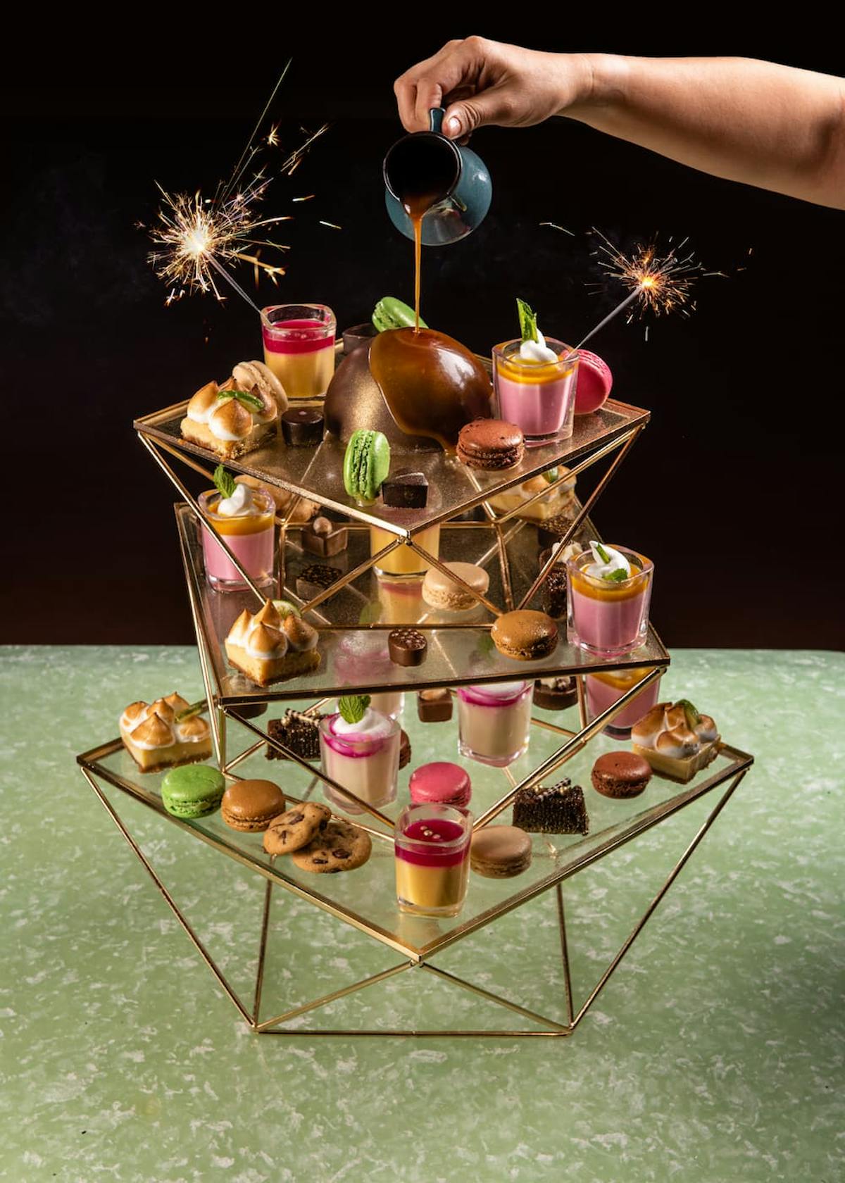 dessert table filled with desserts and treats