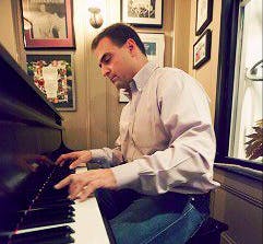 a person standing in front of a piano