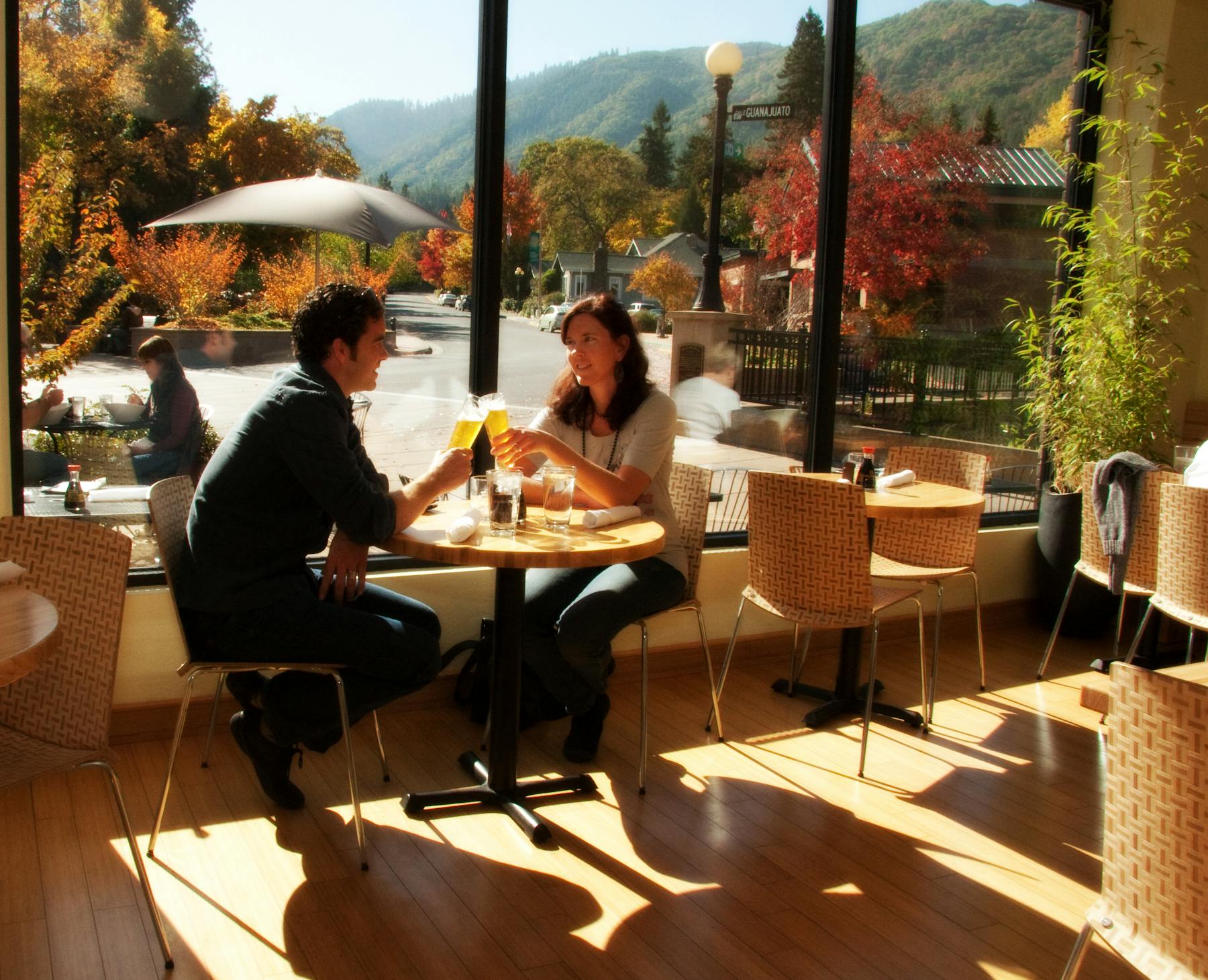 a couple sitting at a table in a restaurant