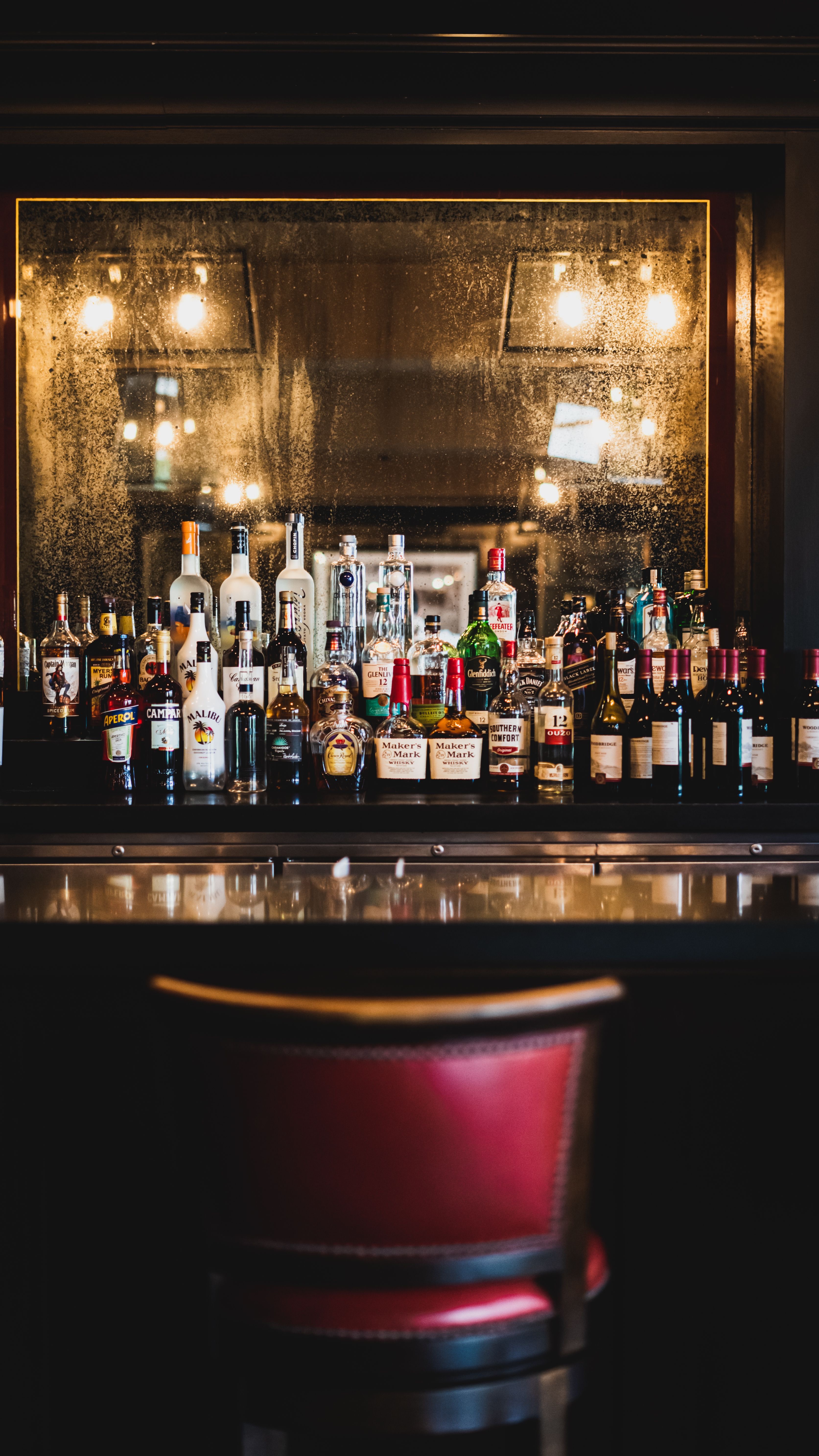 a bottle of wine next to a bar