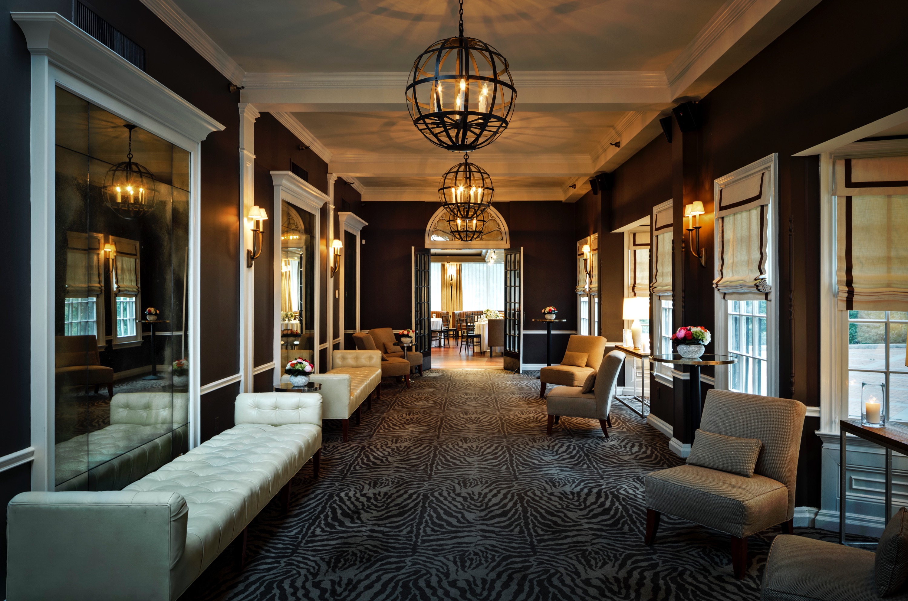 a living room filled with furniture and a large window