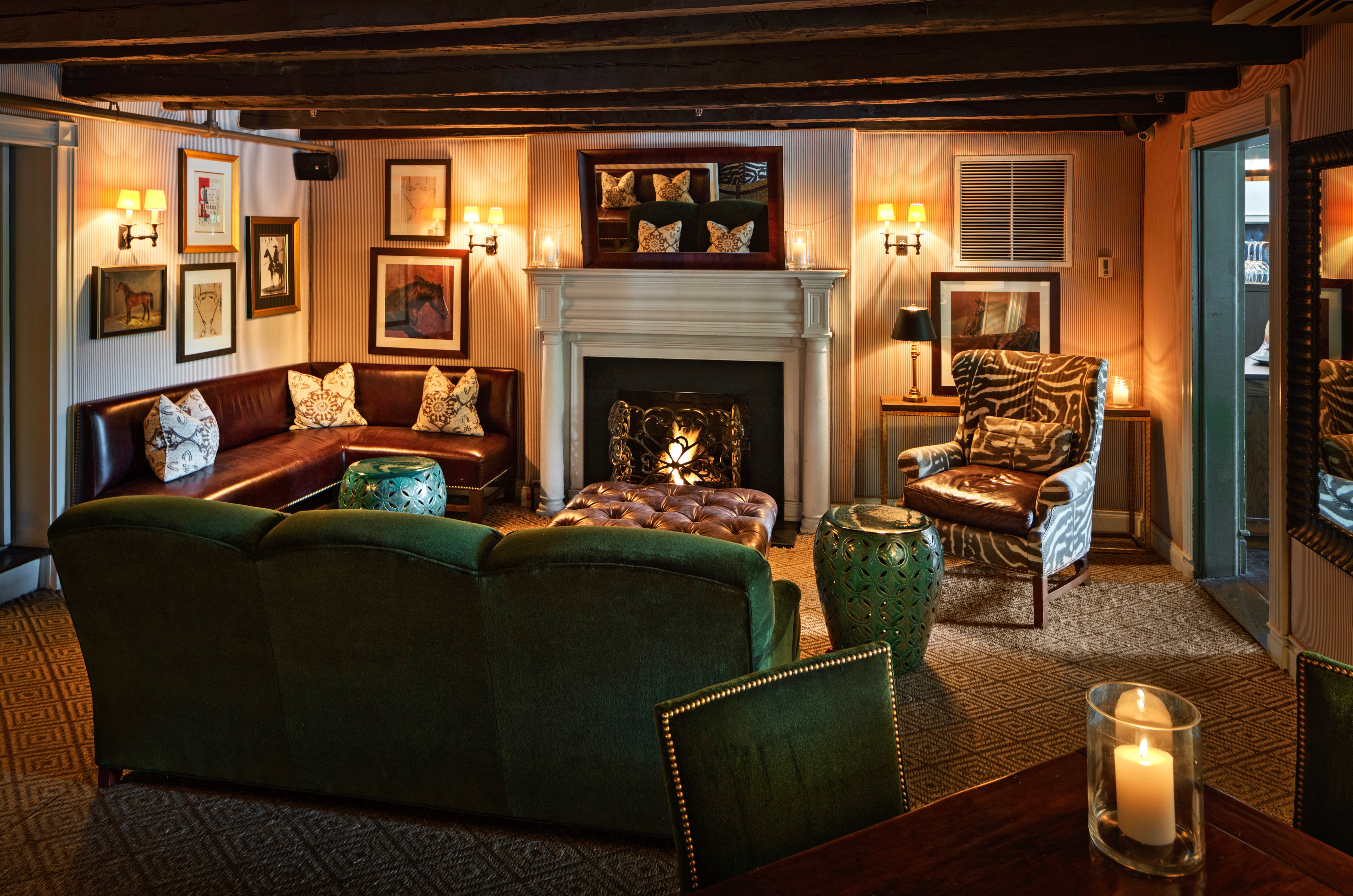a living room filled with furniture and a fire place