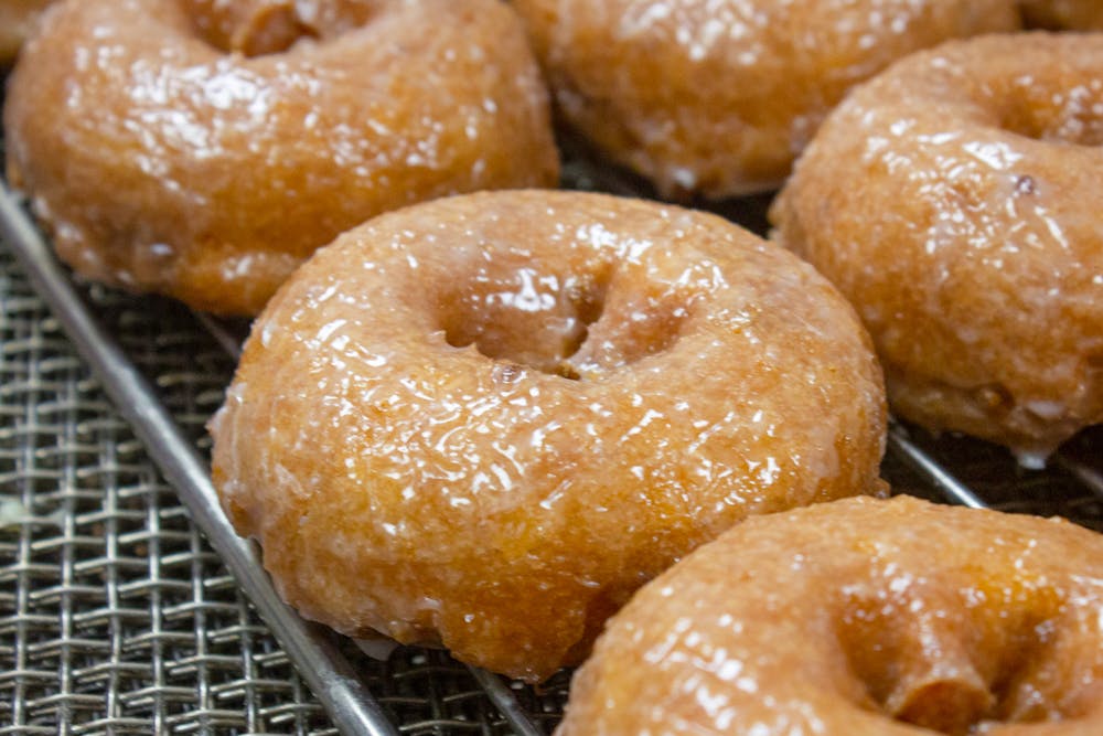 a donut sitting on top of a metal rack