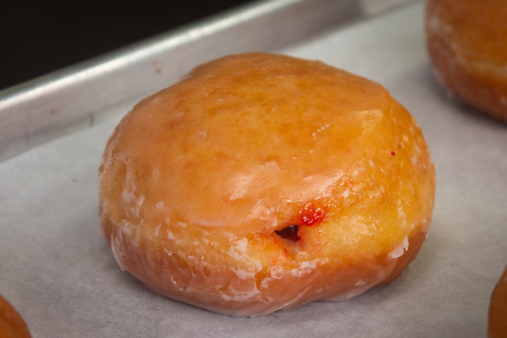 a close up of a doughnut sitting on a table