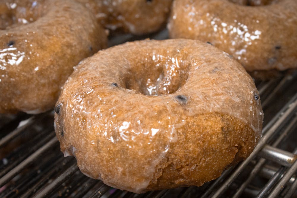 a close up of a doughnut on a grill