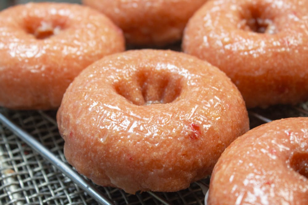 a donut sitting on top of a metal rack