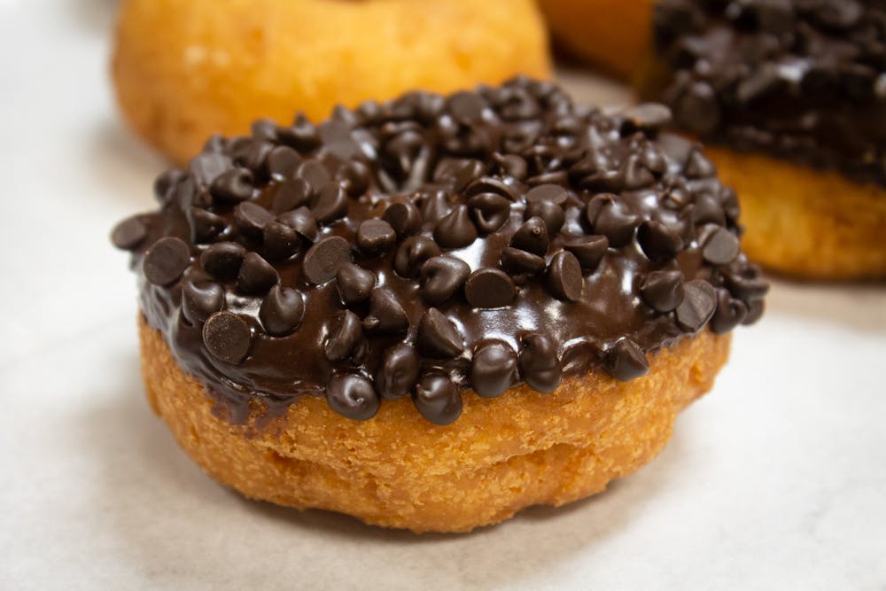 a close up of a piece of cake covered in chocolate