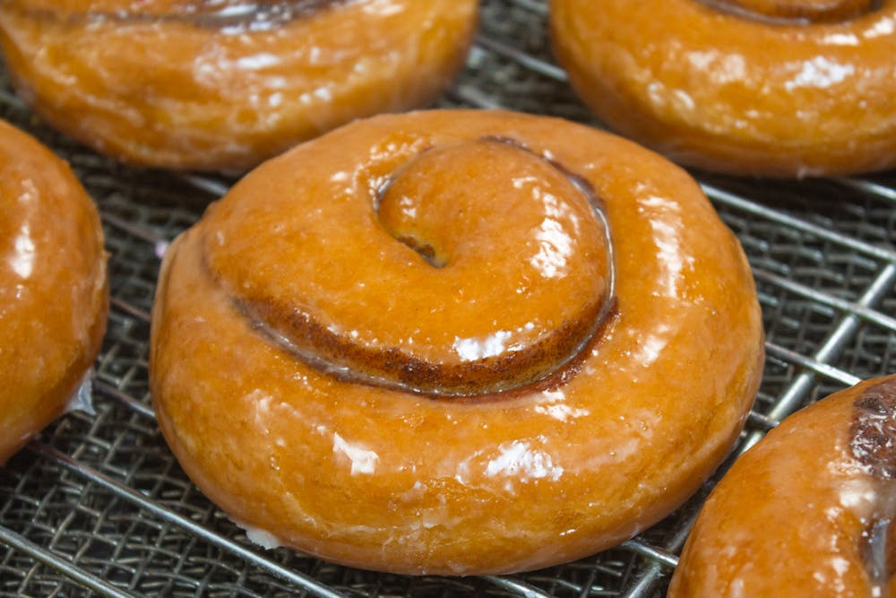a donut sitting on top of a metal rack