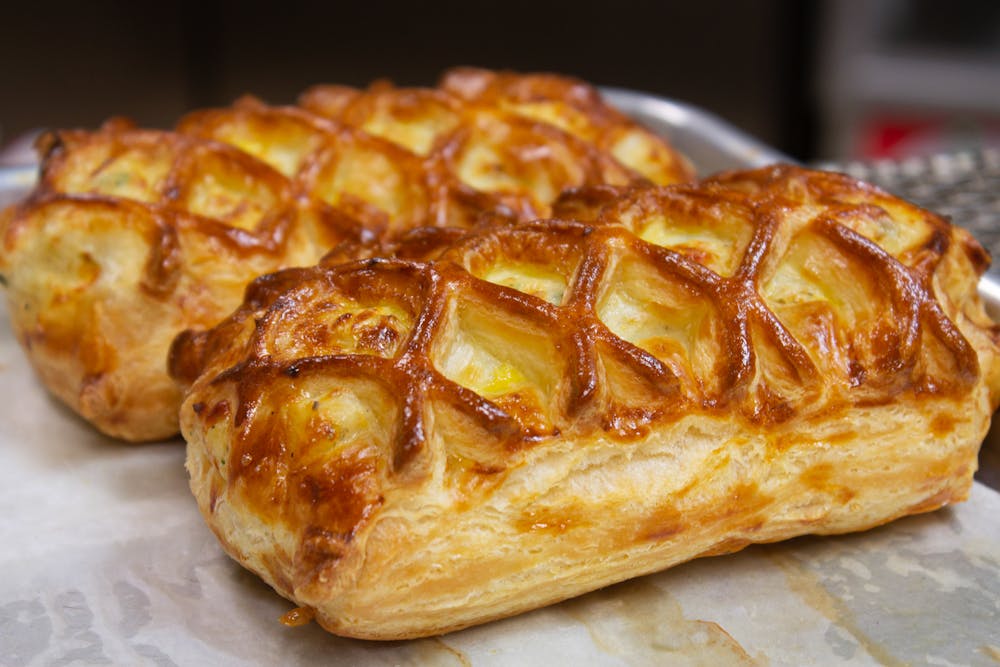 a close up of a piece of pizza