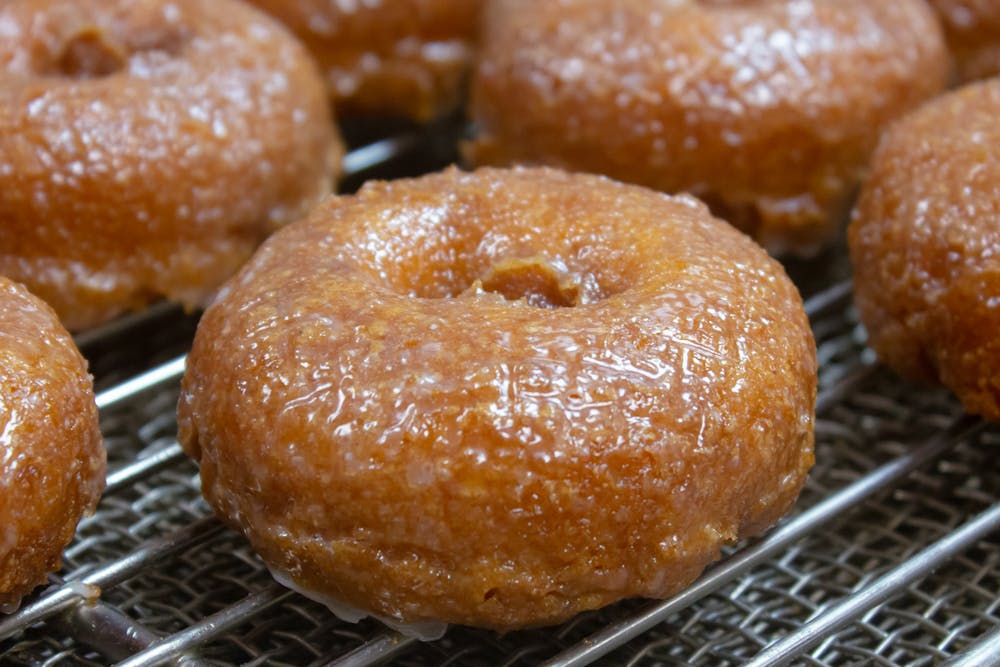 a donut sitting on top of a metal rack