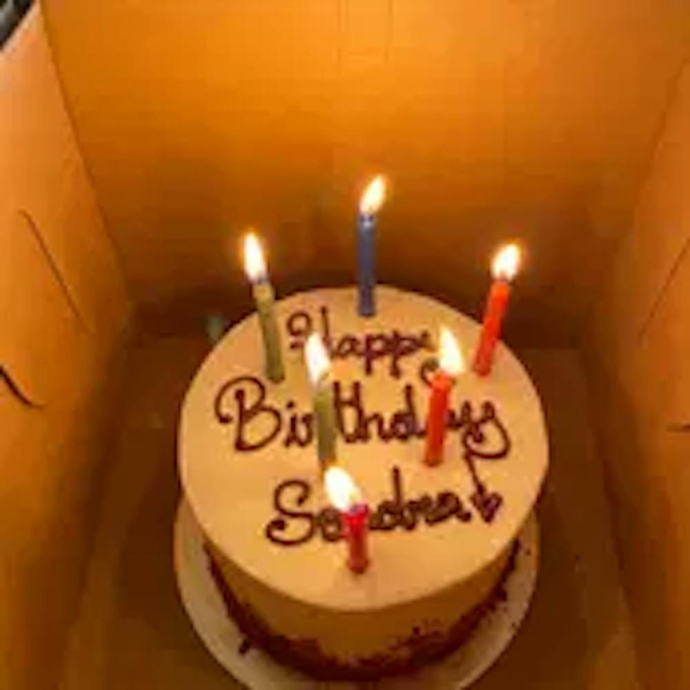 a birthday cake with lit candles