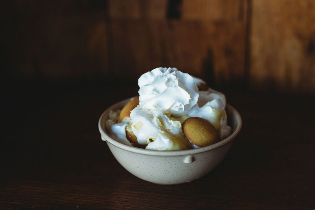 a bowl of food sitting on a table