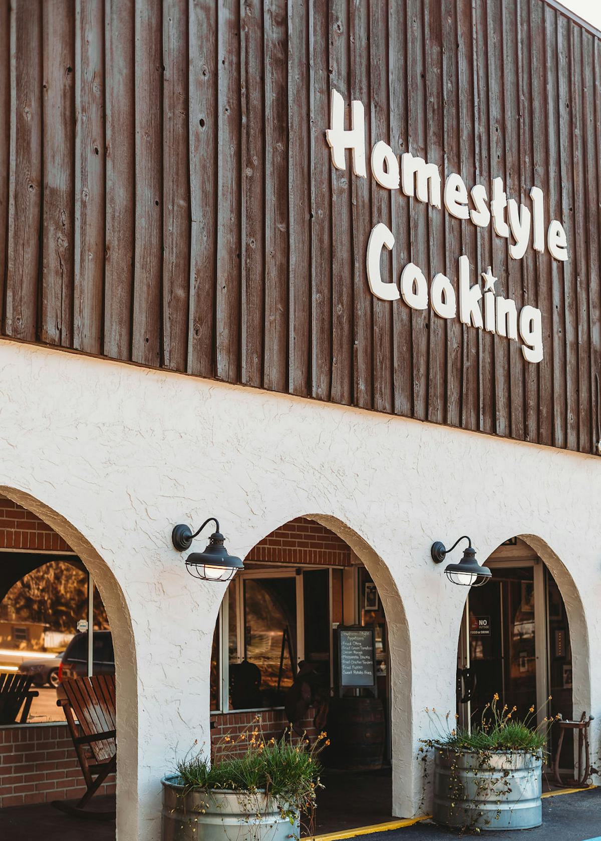 a sign in front of a building