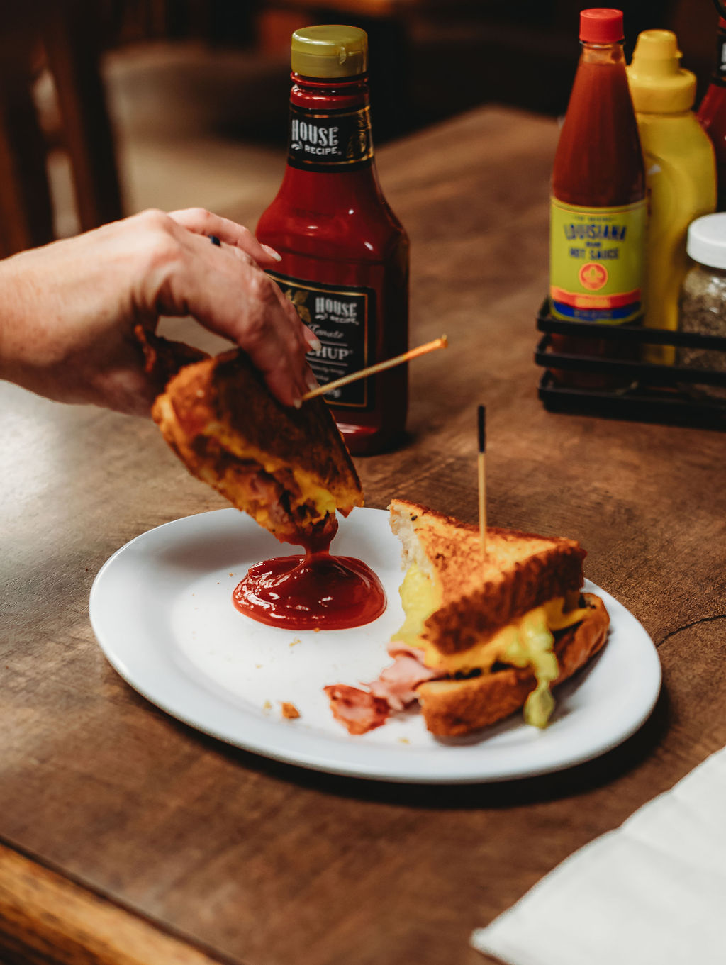 a close up of a plate of food and a bottle on a table