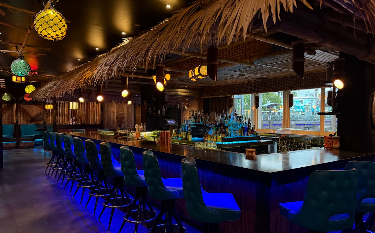 a row of wooden benches sitting on top of a table