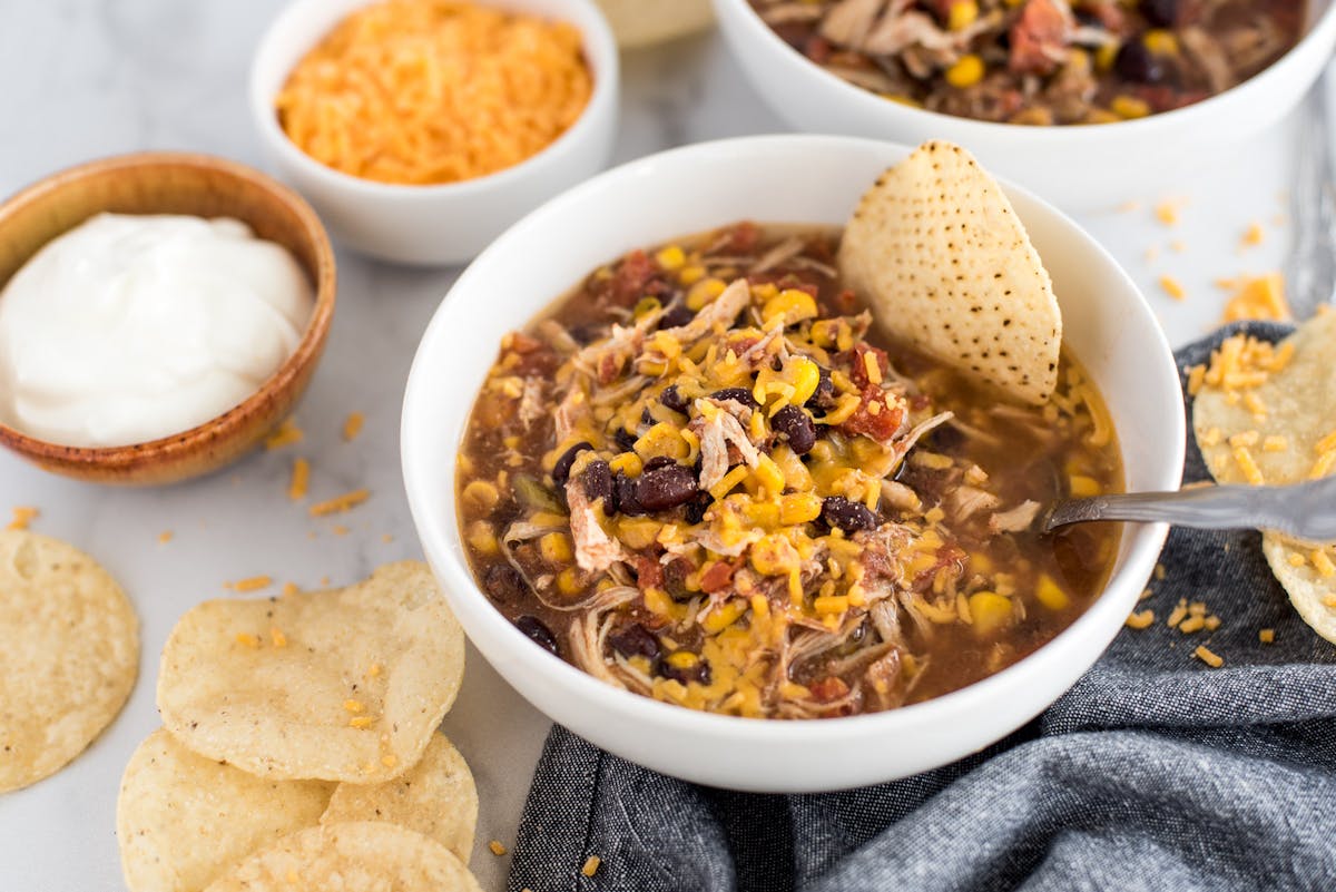 a bowl filled with different types of food on a plate