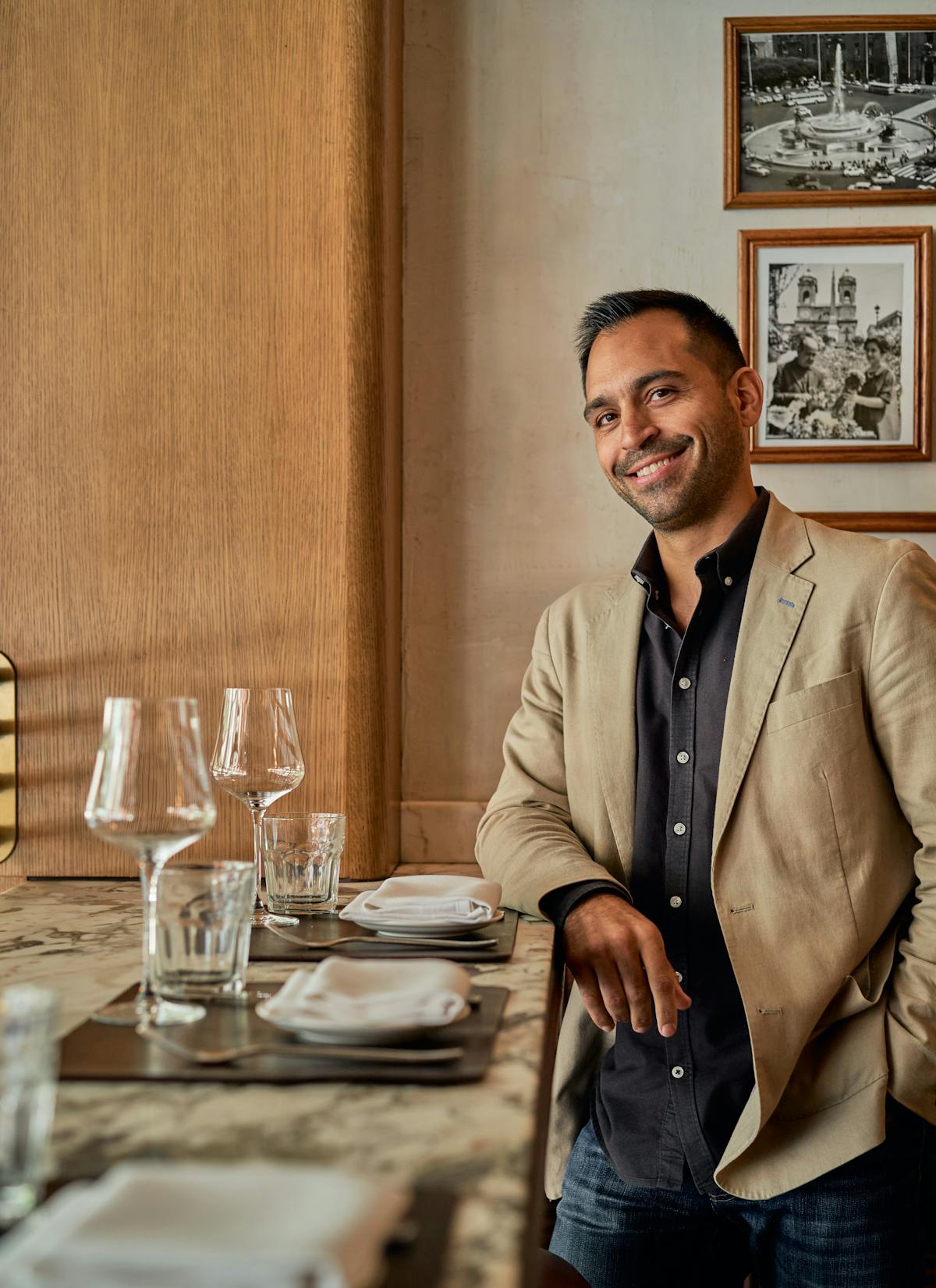 a man standing in front of a table