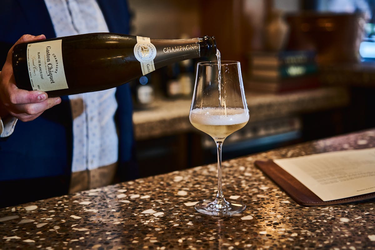 a bottle and a glass of wine
