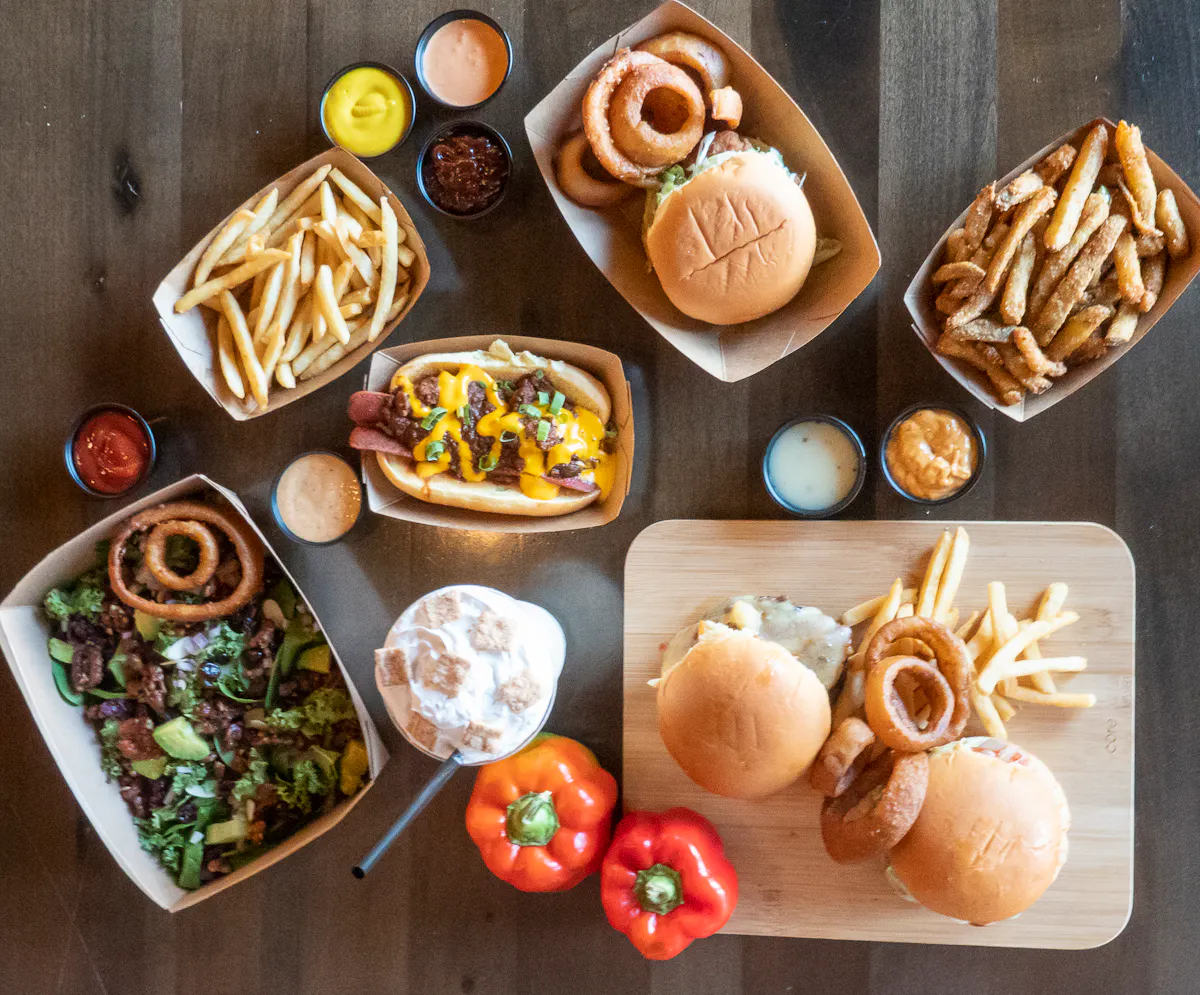 a bunch of food sitting on top of a wooden table