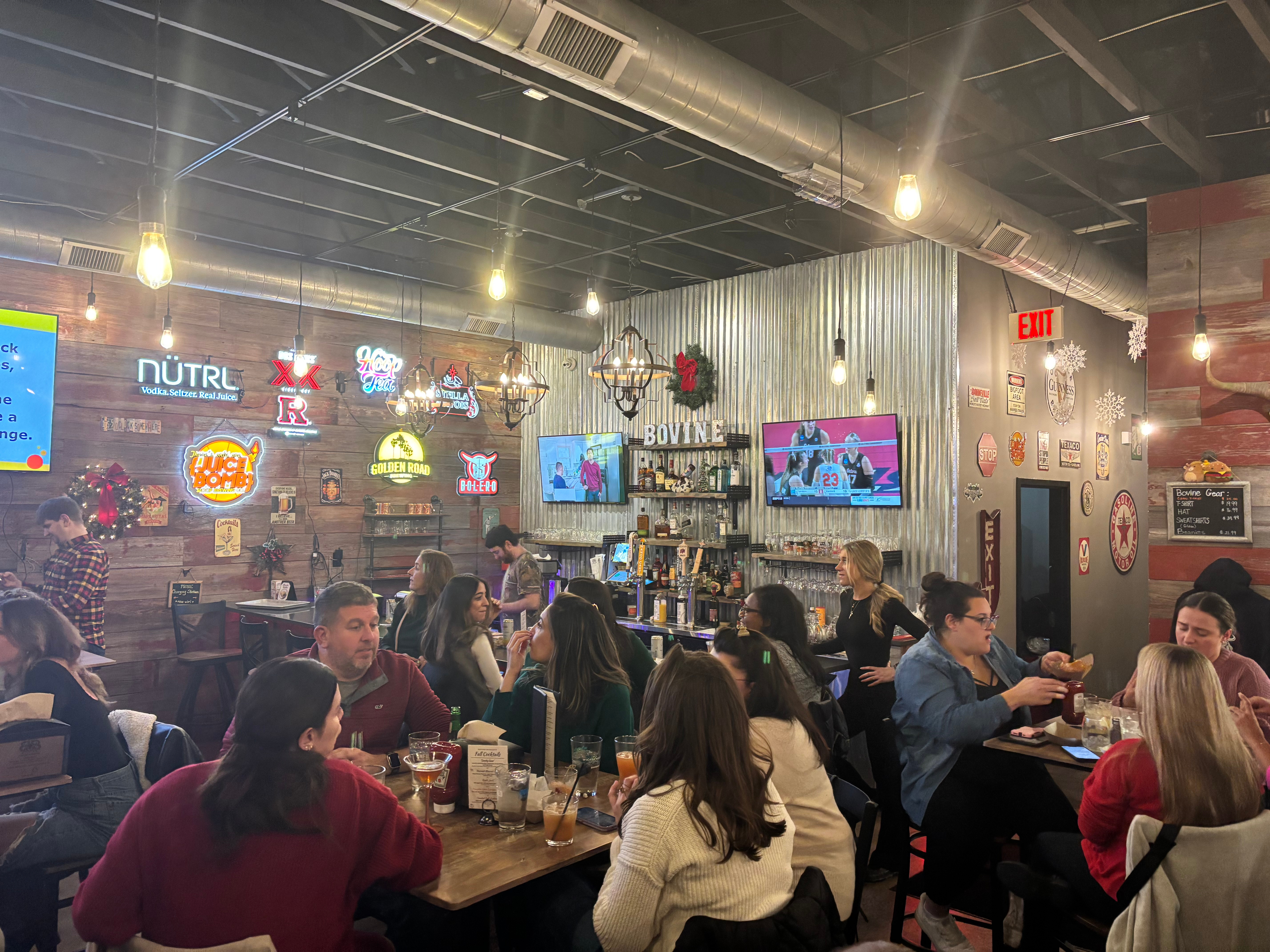 a group of people sitting at a bar