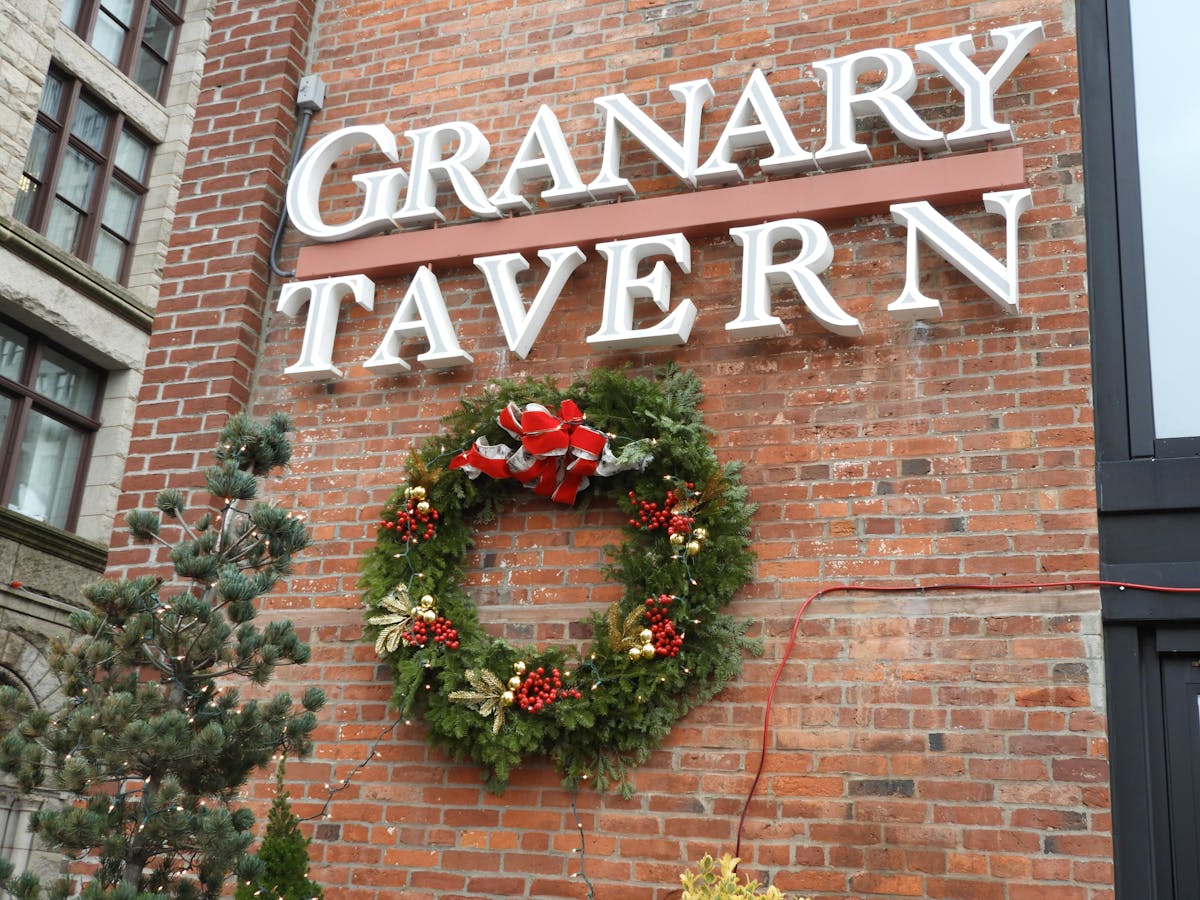 a sign in front of a brick building