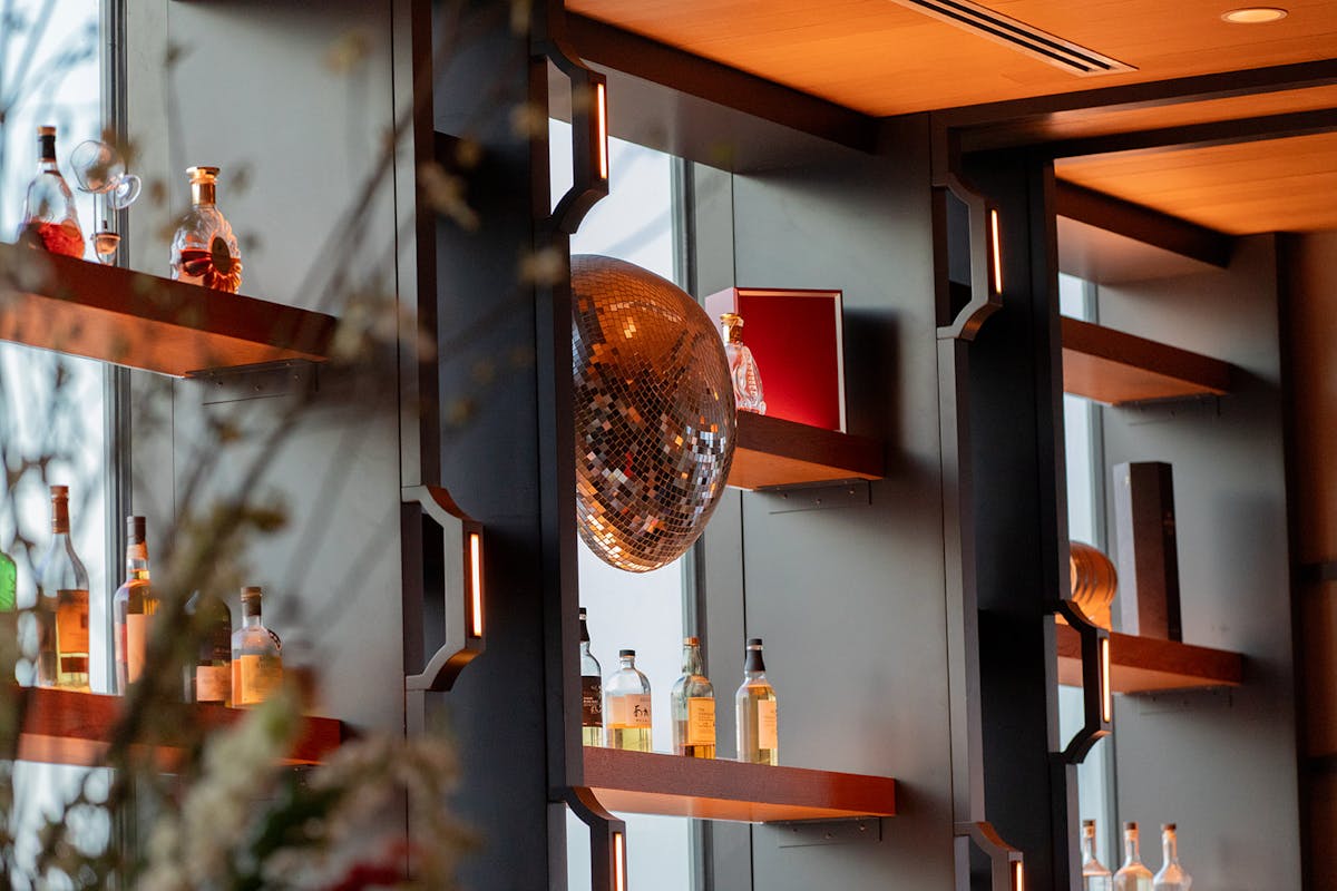 a closeup of the decor behind the bar in tesserae