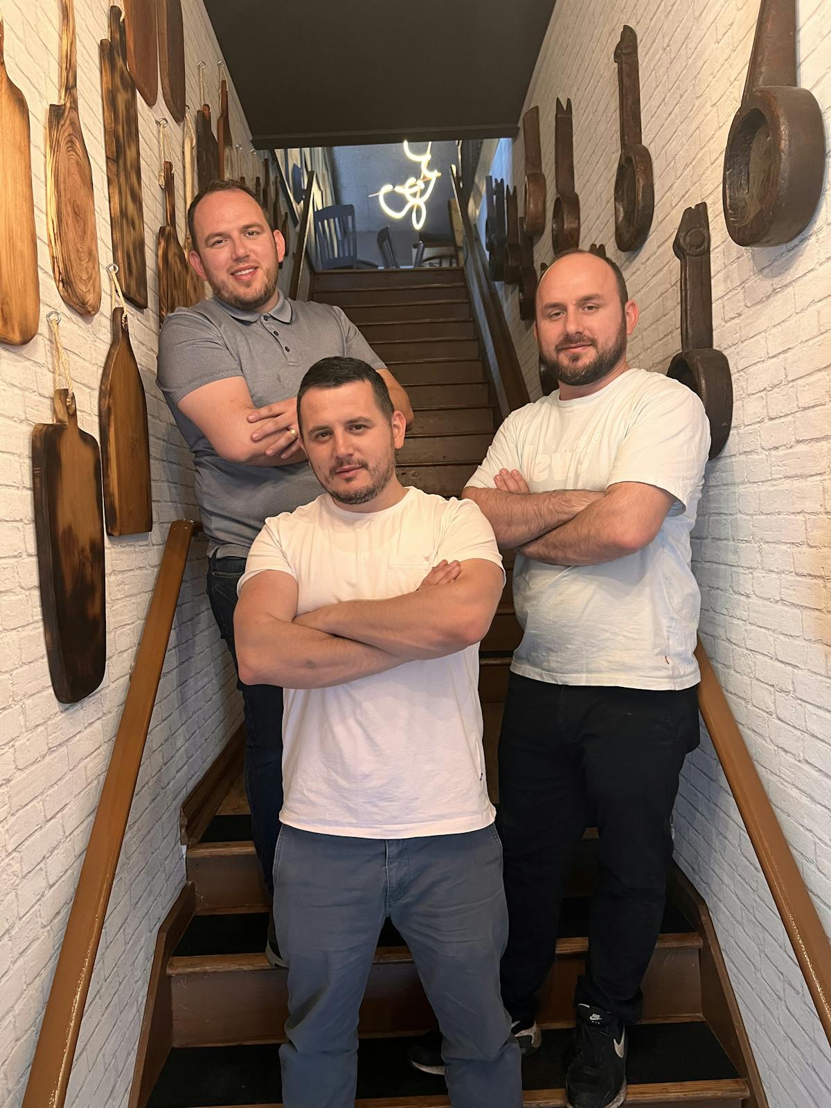 Three men posing for a picture