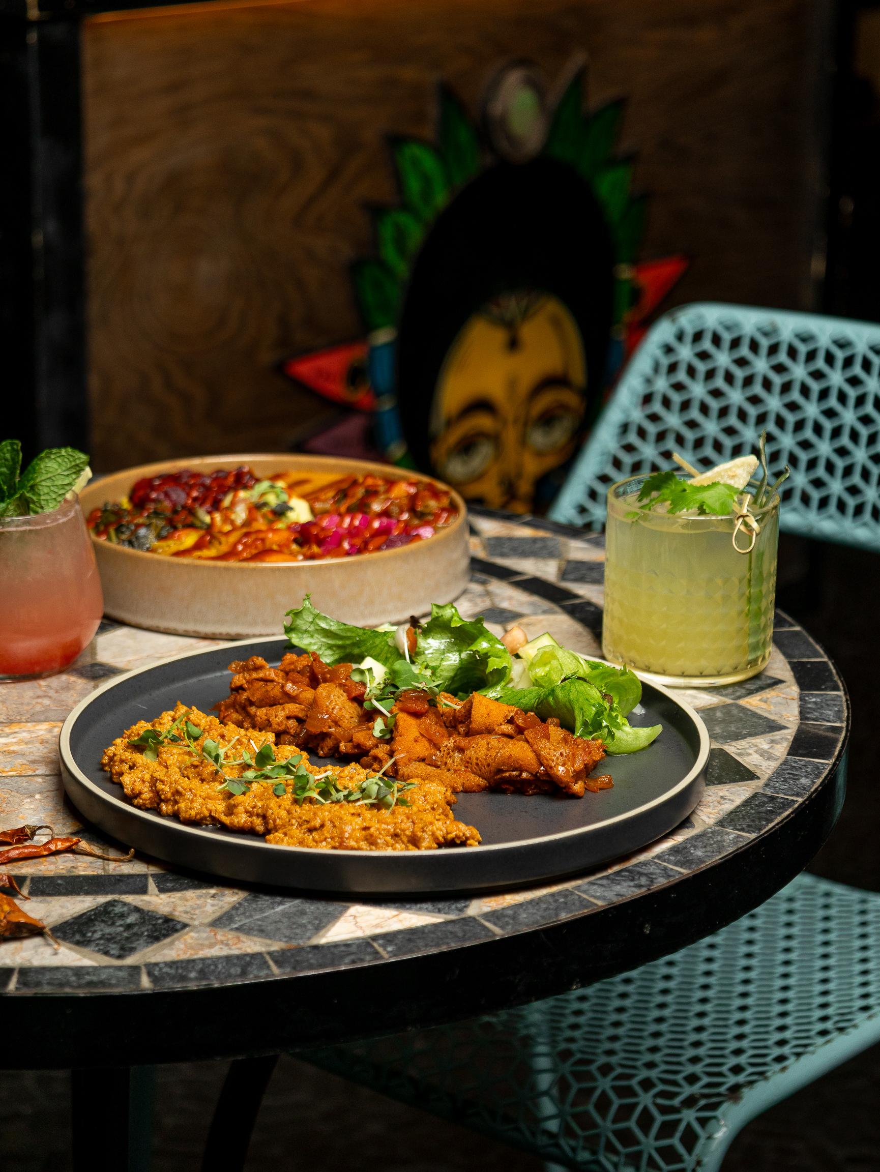 a plate of food sitting on top of a wooden table