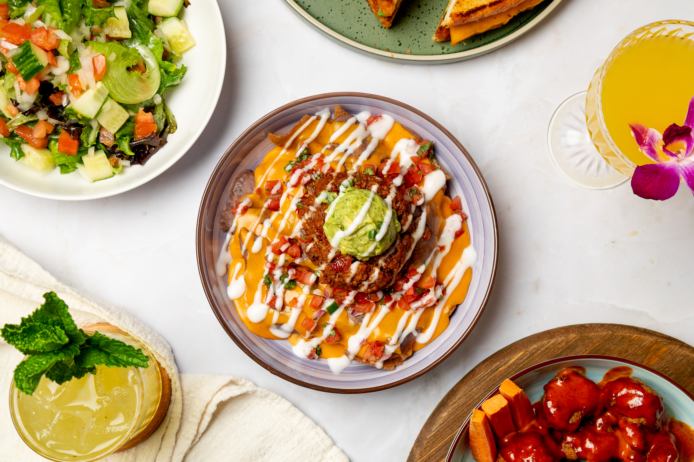 a plate of food sitting on top of a wooden table