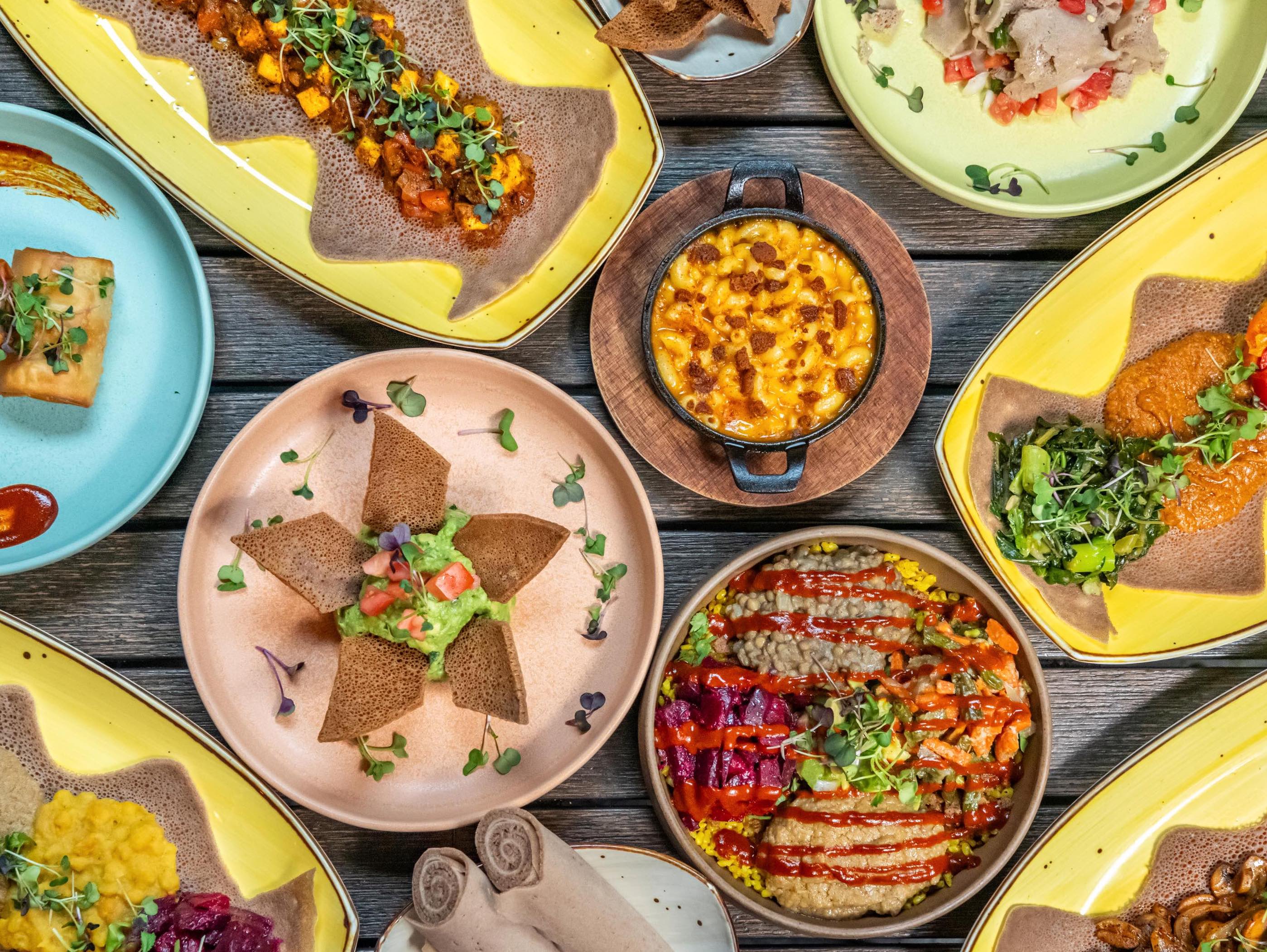 a plate of food sitting on top of a wooden table