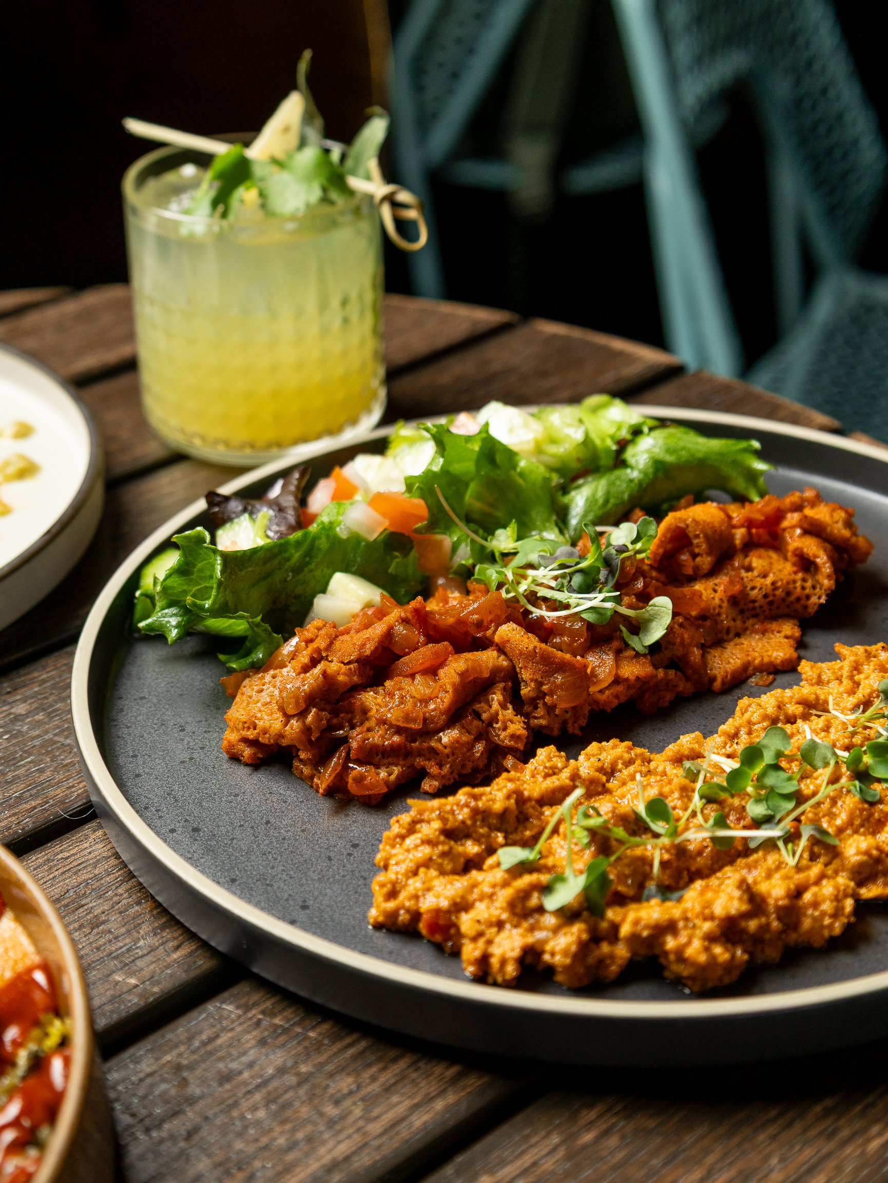 a plate of food sitting on top of a wooden table