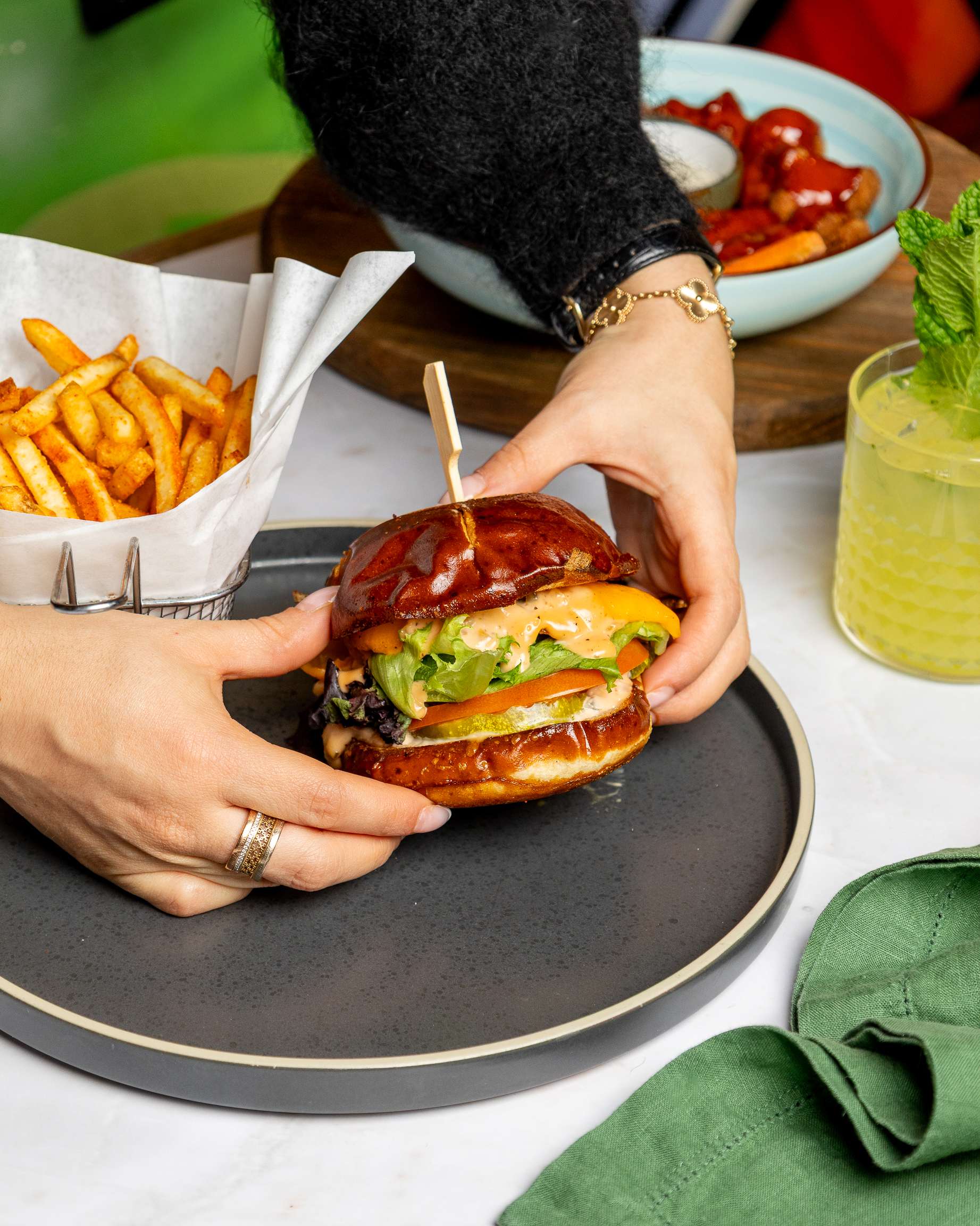 a sandwich sitting on top of a plate of food on a table