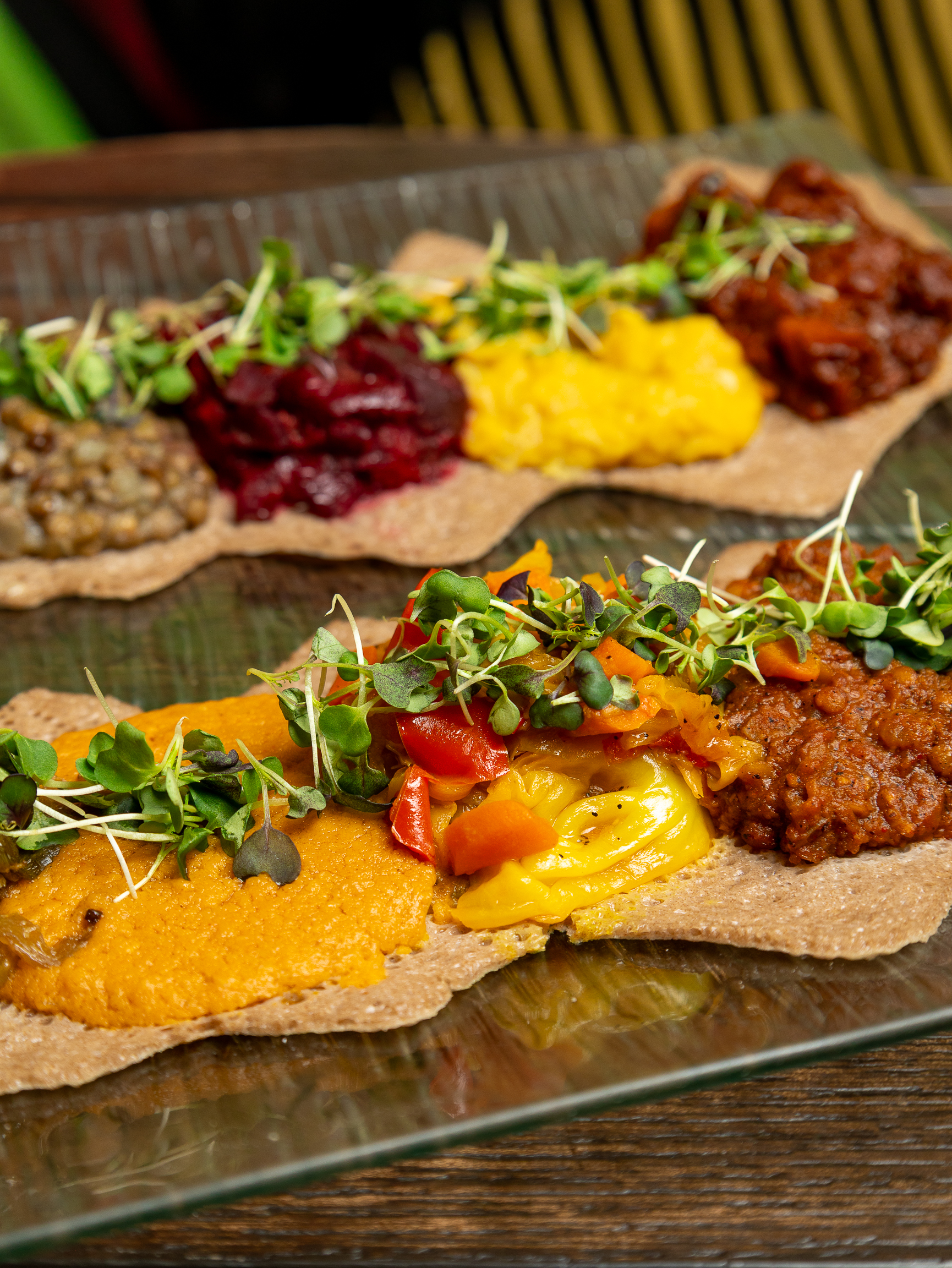 a plate of food sitting on top of a wooden table