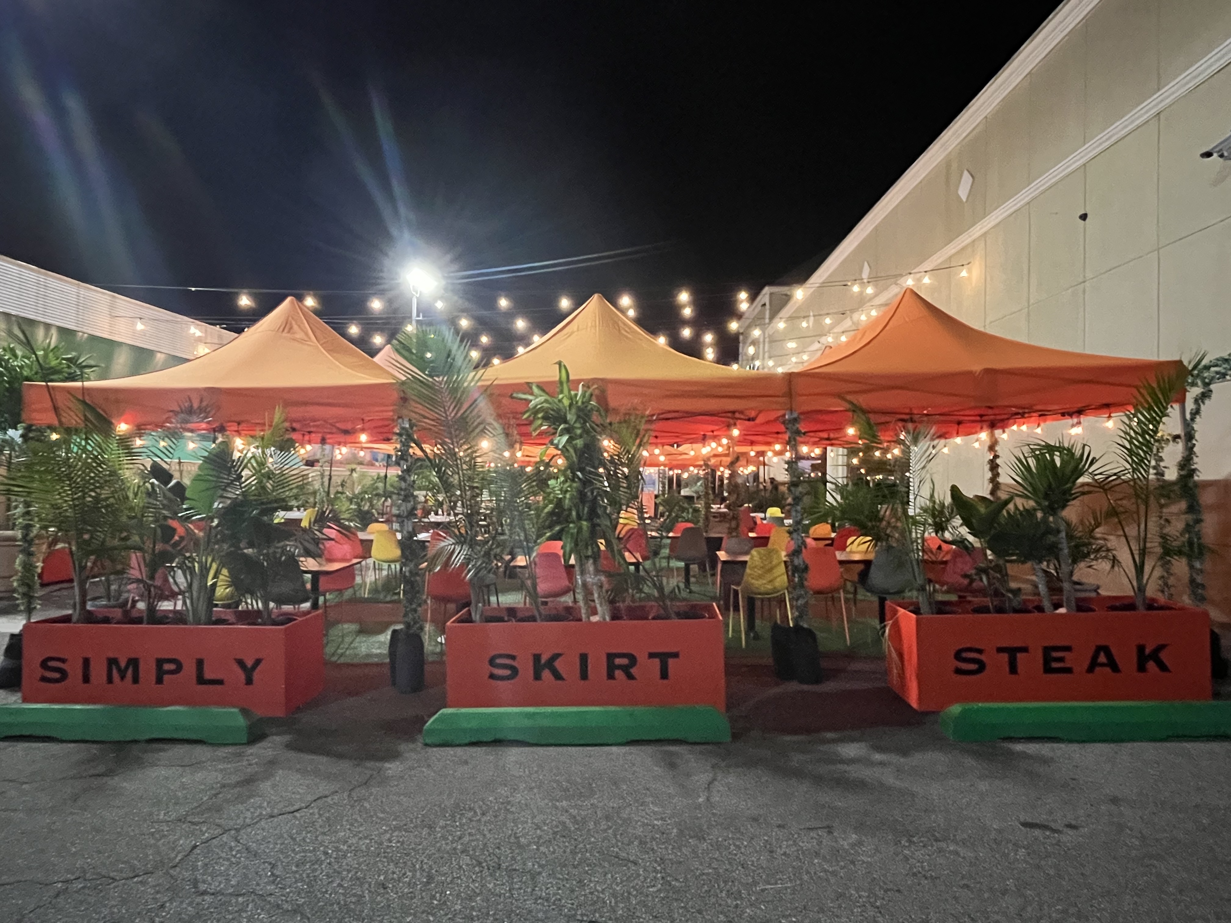 a group of people standing in front of a building
