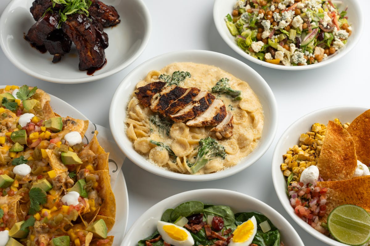 a bowl filled with different types of food on a table