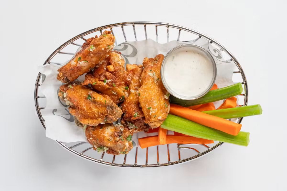 Chicken wings with celery, carrots and ranch from the 1983 late night menu in South Tampa