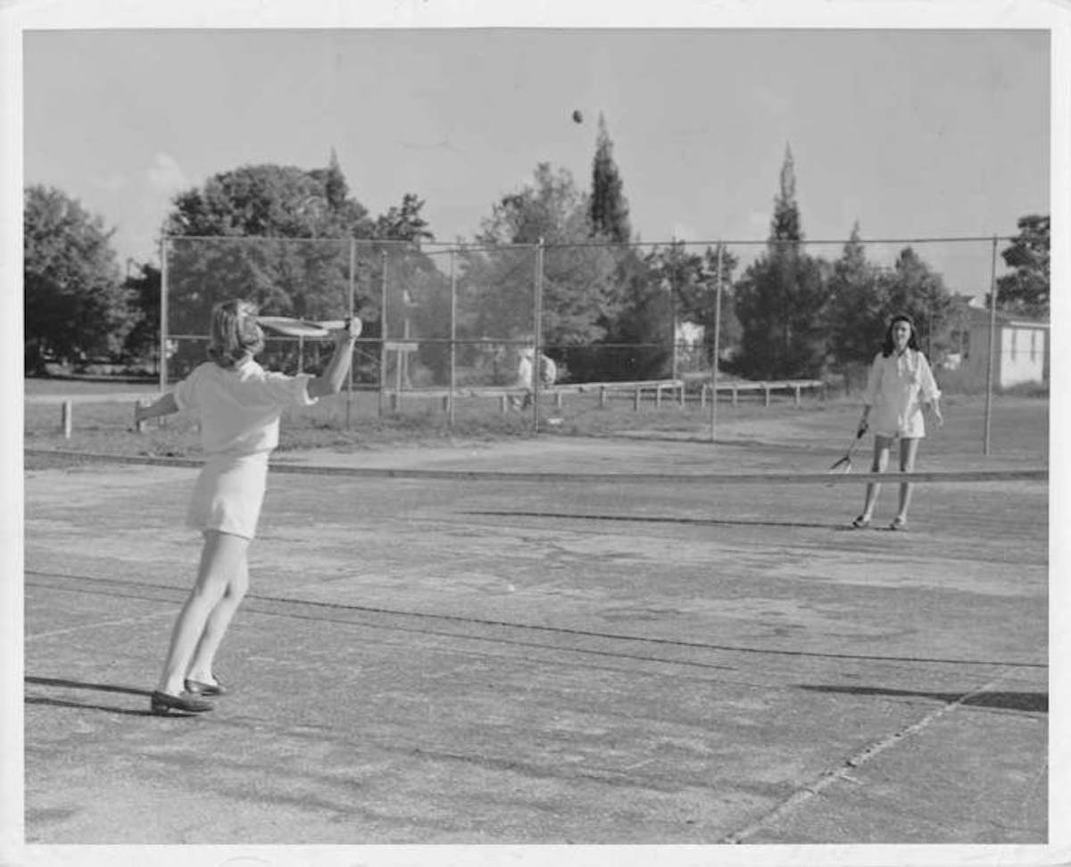 a vintage photo of a person playing a game of baseball