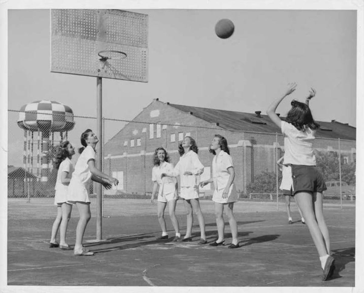 a group of people playing a game of baseball