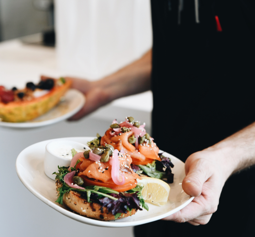 a person holding a plate of food