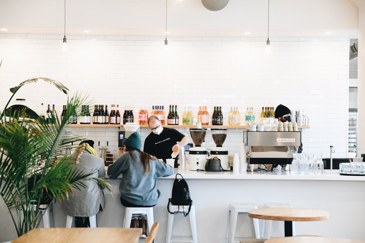 a kitchen with a table and chairs
