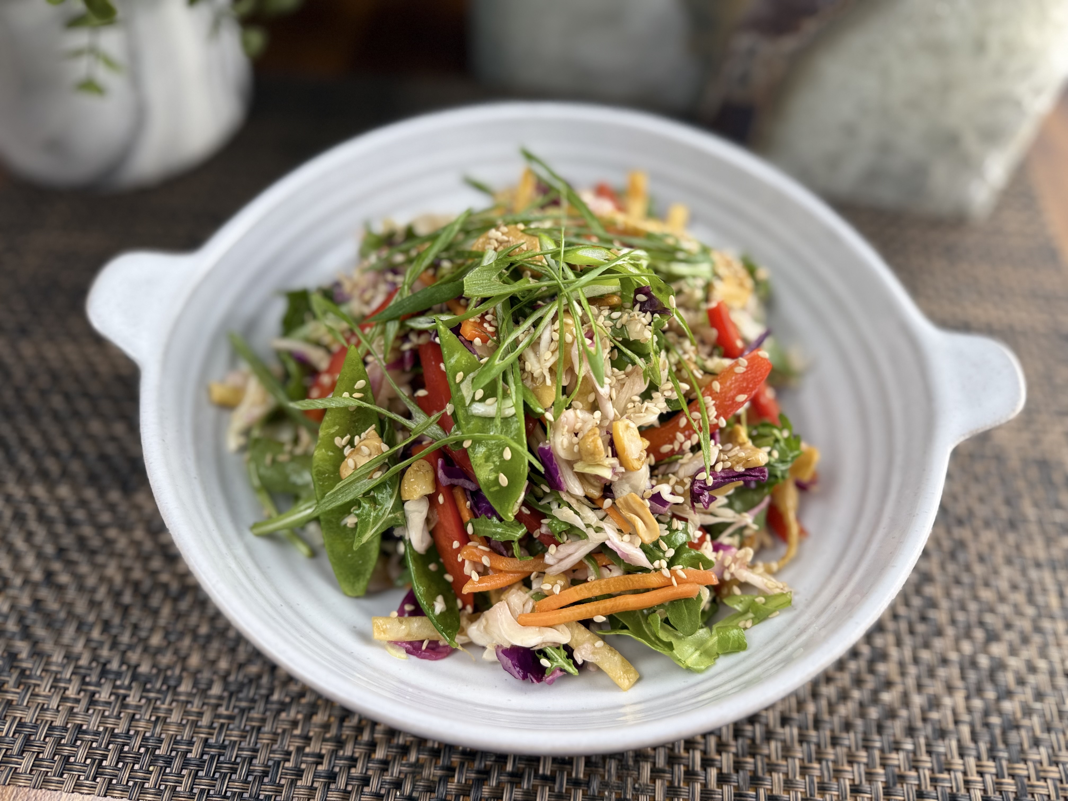 a bowl of salad on a plate