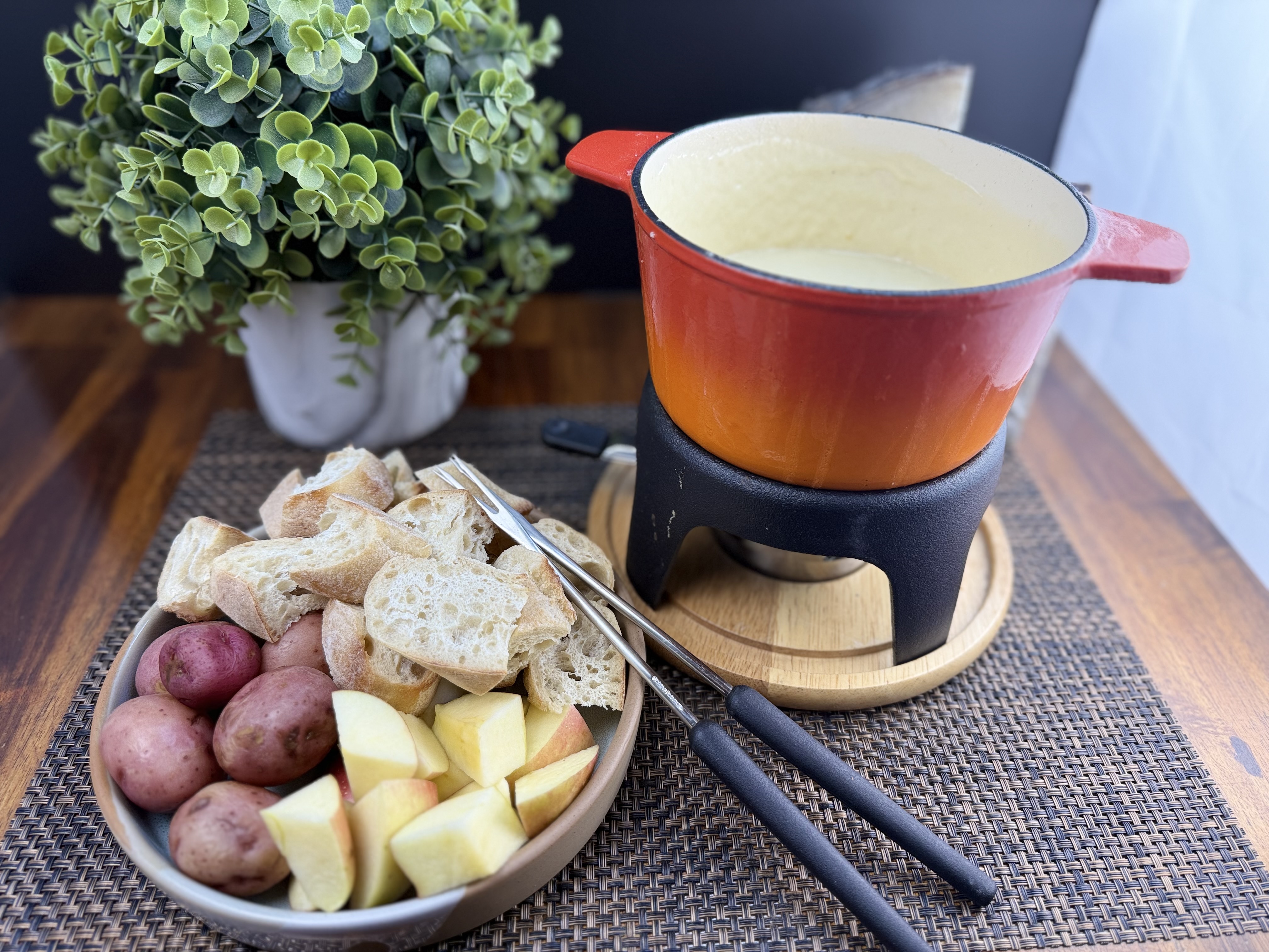 a bowl of fruit sitting on a table