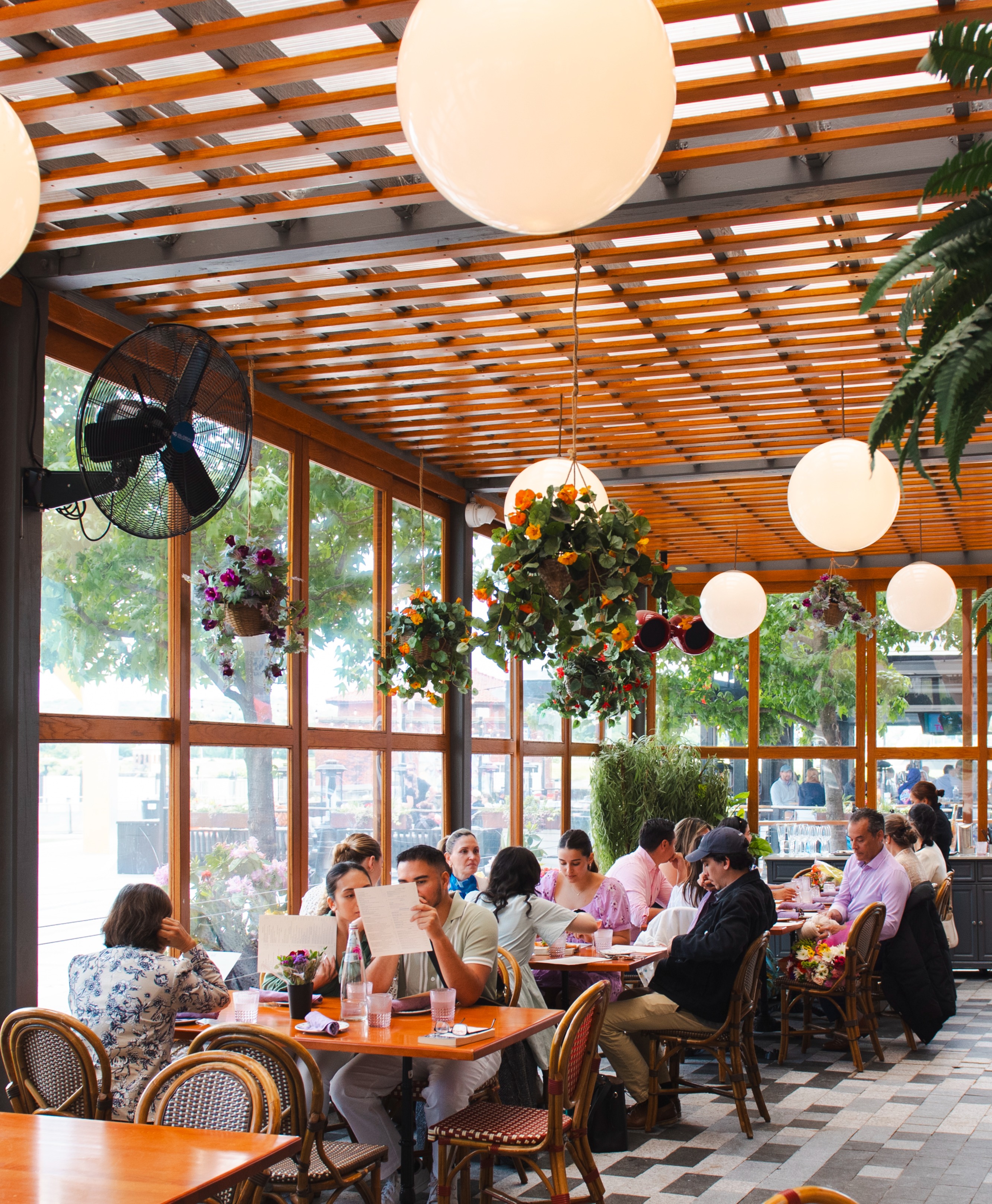 a group of people sitting at a table in a restaurant