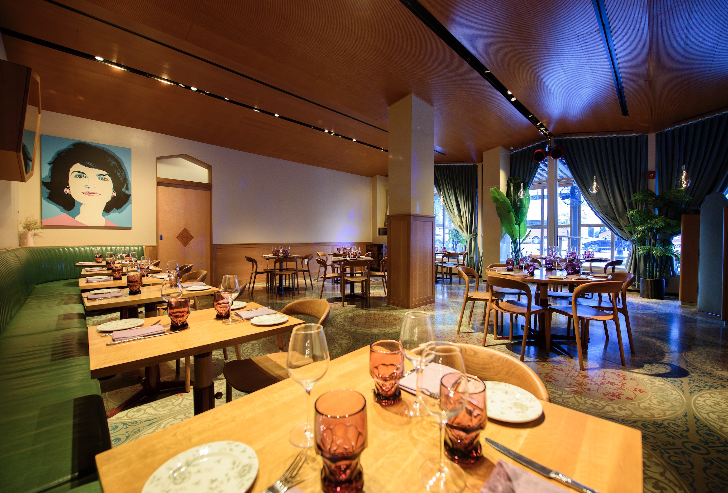 Jackie Restaurant dining room with the Jackie portrait, tables set for dinner at 79 Potomac Ave SE in Navy Yard, across from Nationals Park