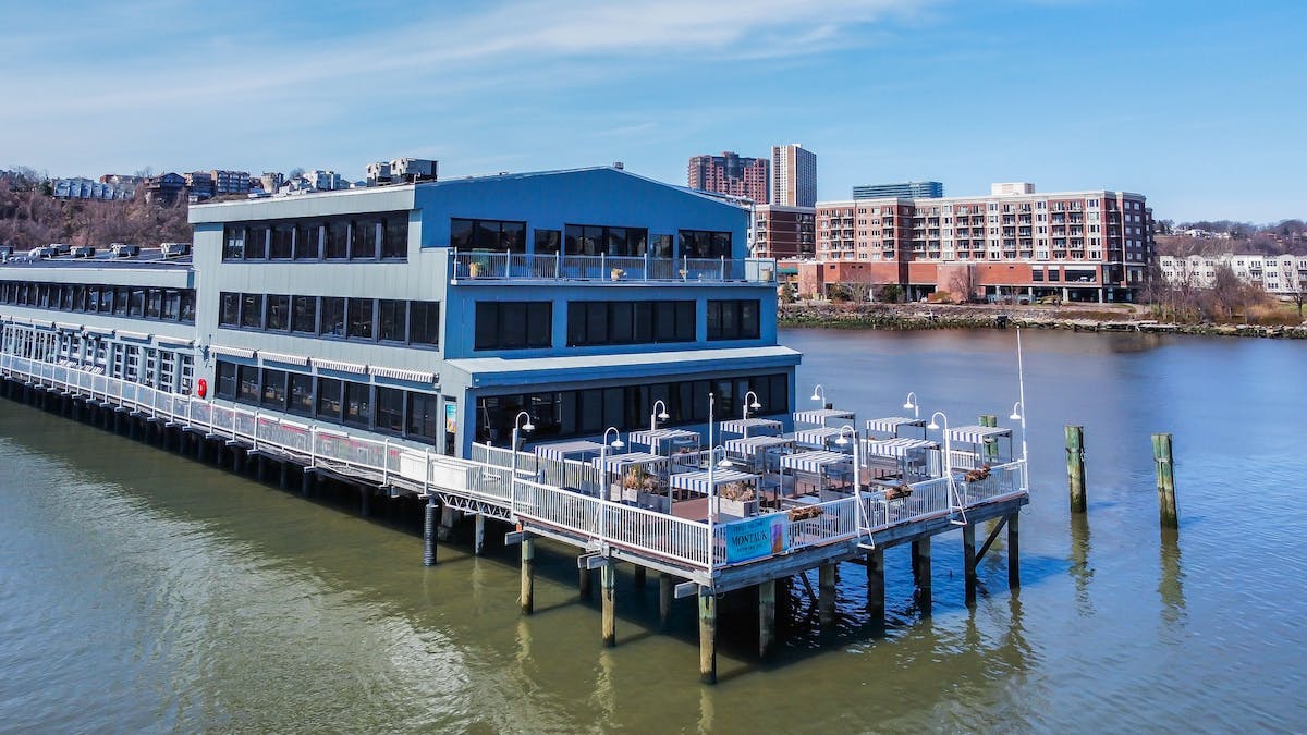 a boat is docked next to a body of water