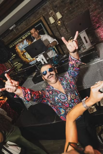 a group of people playing instruments and performing on a stage