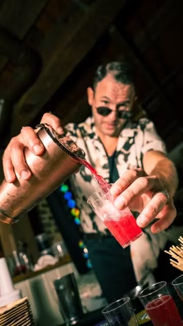 a person holding a glass of wine